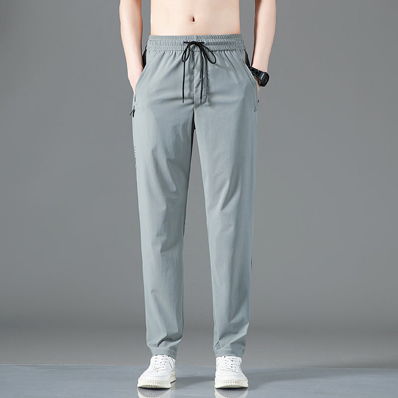 ArcticFlex Men's Ice Silk Casual Pants in gray, designed for comfort and style during warmer months.